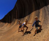 Kids catching Wave Rock